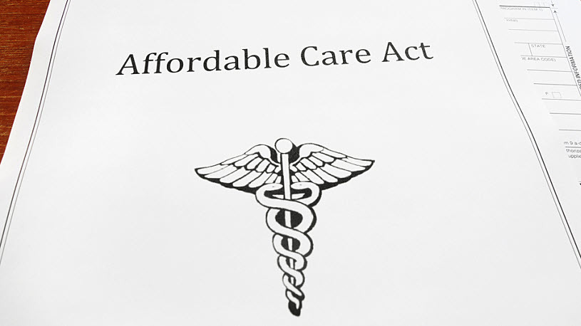 photo of Affordable Care Act paperwork fanned out on a desk