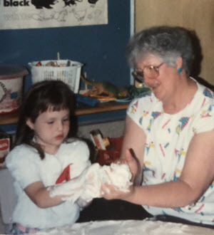 Lyndze with her grandma Mo performing a science experiment at pre-school