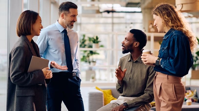 Group of new employees chatting in the office