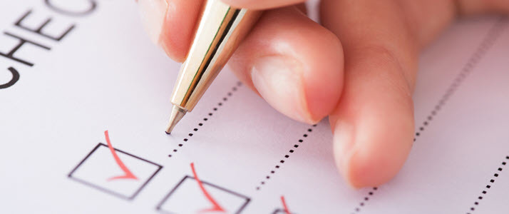 hand of business woman with pen and checklist hand of business woman with pen and checklist