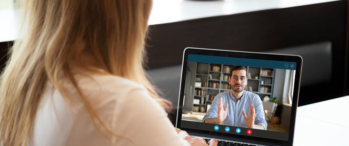 HR professionals talk during a video chat