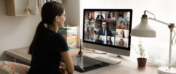 woman at home office on web meeting Now More Than Ever: The Importance of Sustained Change Management and Communications