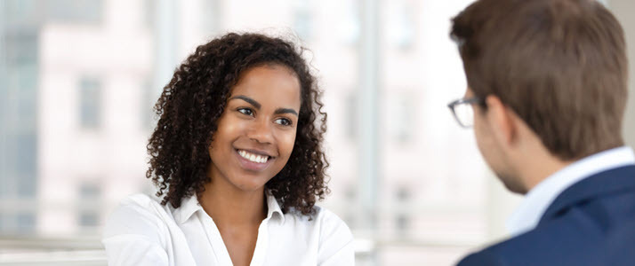 Staffing at Speed A hiring manager smiles at a candidate after an interview