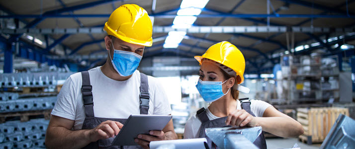 Why You Shouldnt Call Humans Resources Coworkers in hard hats and masks chatting