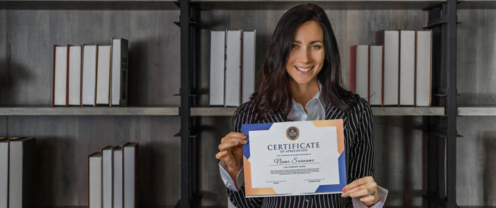 Female employee shows appreciation certificate
