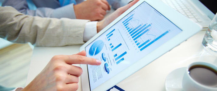 Data and people Analytics A tablet displays data and people analytics about a business