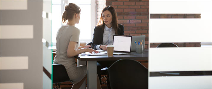 business women in office having mentoring meeting What Makes a Stellar Mentoring Relationship? 4 Key Elements
