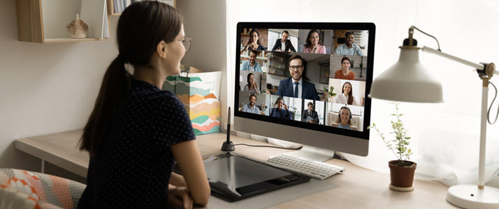 young woman on video conference at home desk