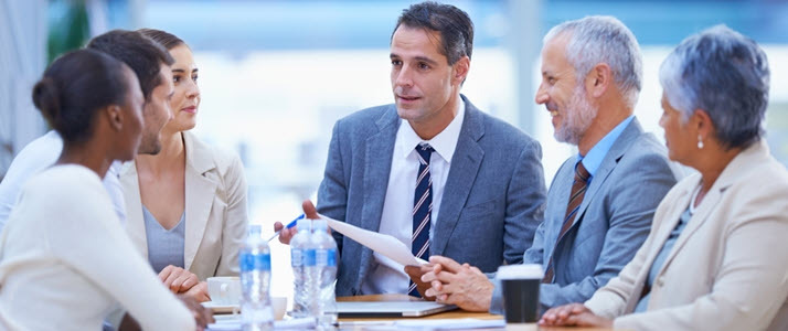 data leads the way to a more inclusive future of work business people of diverse ages and genders having a meeting around a table