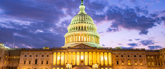US Capitol Building wtih dark sky behind
