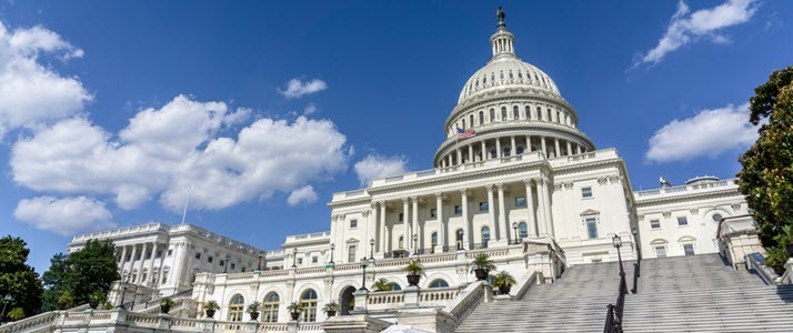 US Capitol with blue cloudy sky behind