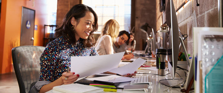 The Pay Gap Against Latina Women A Latina woman works in a modern tech setting