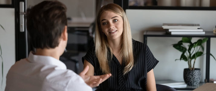 professional male manager counseling female employee