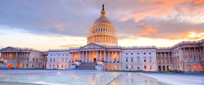 Photo of the United States Capitol at sunset Photo of the United States Capitol at sunset