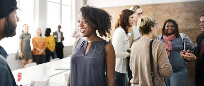 group of casual diverse employees talking in conference room group of casual diverse employees talking in conference room