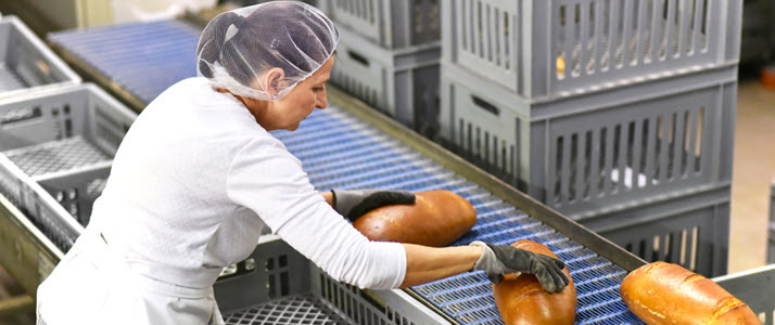 woman working at bakery factory woman working at bakery factory