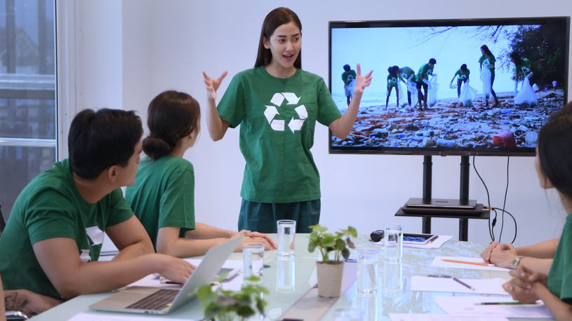 Employees in conference room planning environmental clean-up Employees in conference room planning environmental clean-up