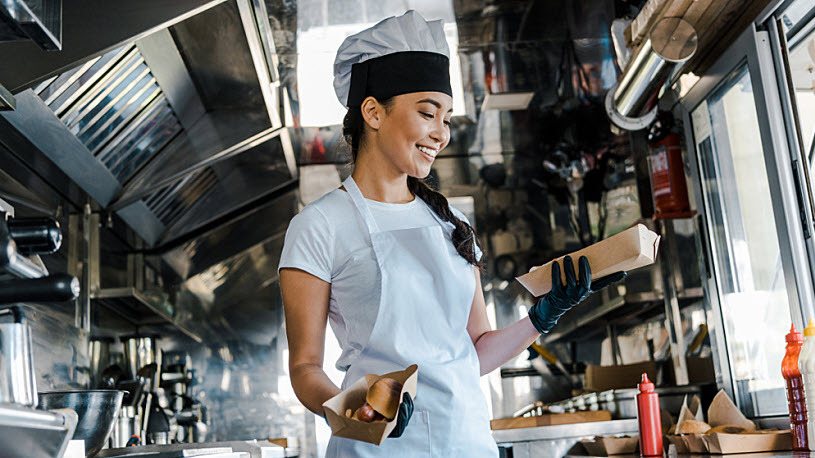 Photo of a woman managing her food truck as side career