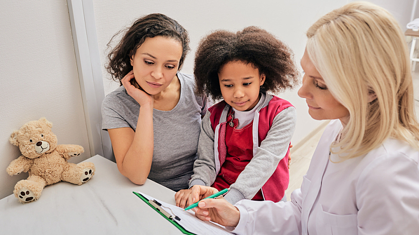 Rethinking Benefits: Employee Experience and Compliance Photo of doctor, mother and daughter in medical exam room