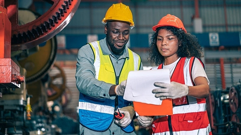 Male and female technicians looking at clipboard documentation 3 Reasons Why the Right Time Tracking Solution is Key to Managing Labor Costs