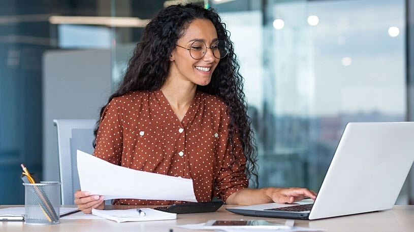 Latin American businesswoman working at desk Latin American businesswoman working at desk