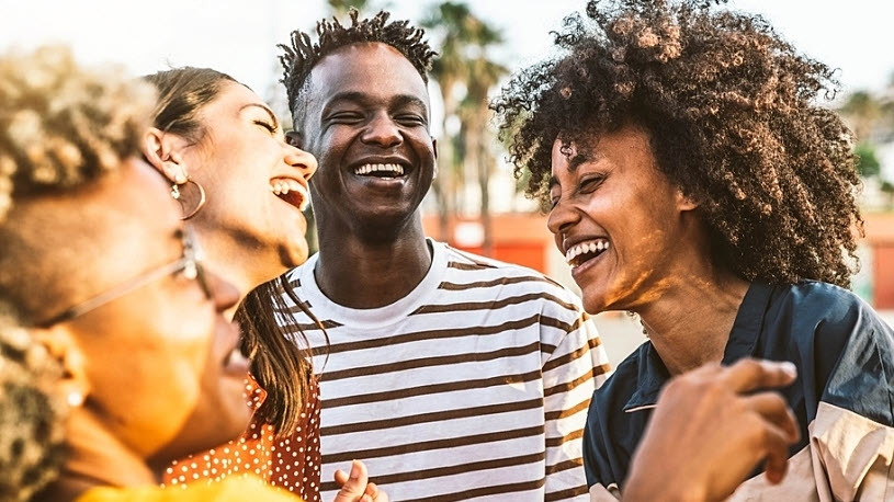 group of casual diverse employees laughing outside