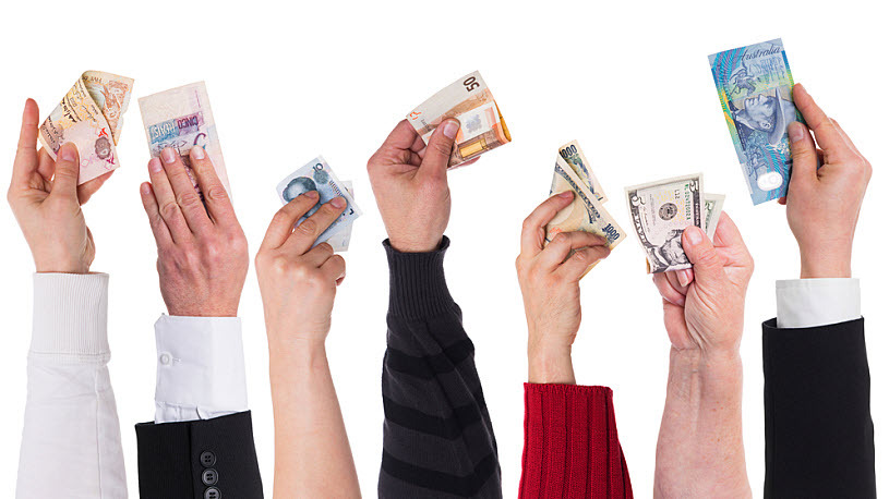 Global Payroll Services Image showing hands holding worldwide currency