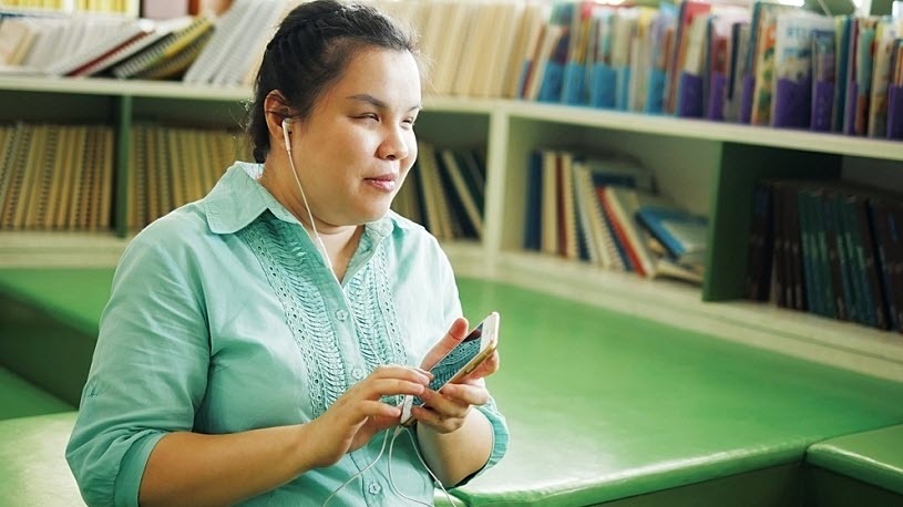 Photo of Asian woman with visual impairment using smart phone Photo of Asian woman with visual impairment using smart phone