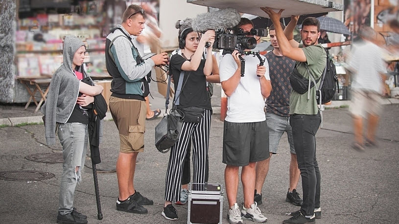 photo of film crew shooting movie scene outdoor location photo of film crew shooting movie scene outdoor location