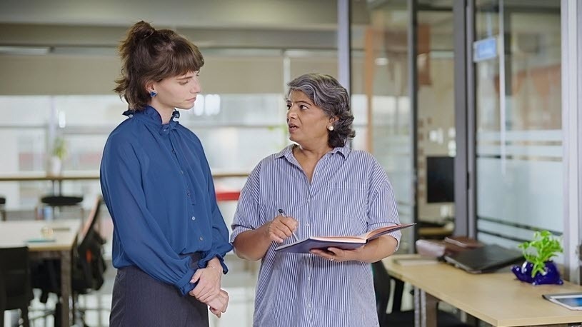 senior manager has serious conversation with young employee senior manager has serious conversation with young employee