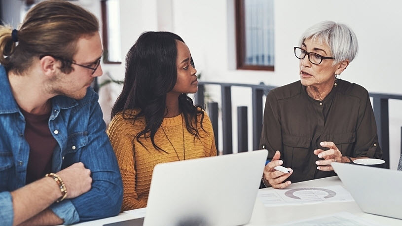Diverse manager with employees Diverse manager with employees