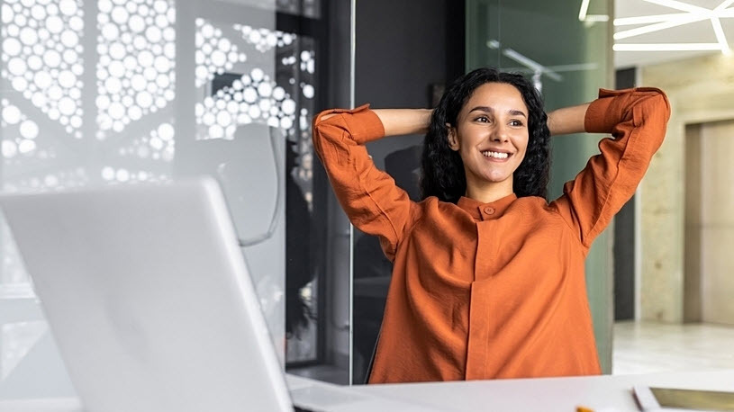 Successful hispanic professional woman at desk smiling Successful hispanic professional woman at desk smiling