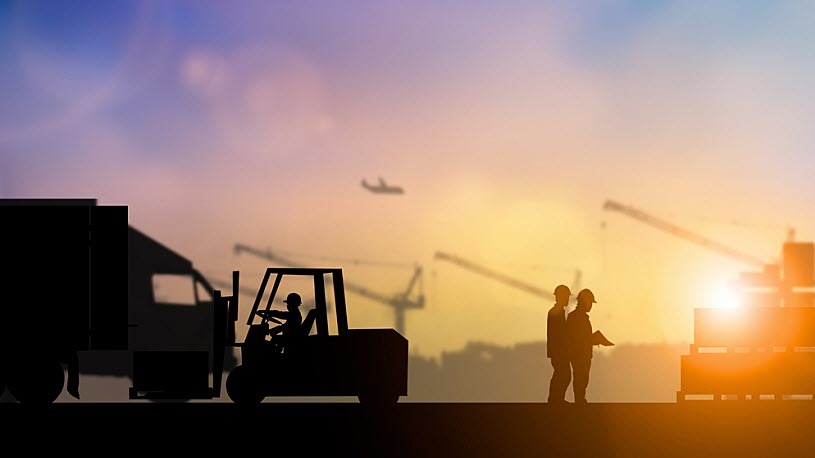 Sunset silhouettes of construction equipment, workers and cranes Sunset silhouettes of construction equipment, workers and cranes
