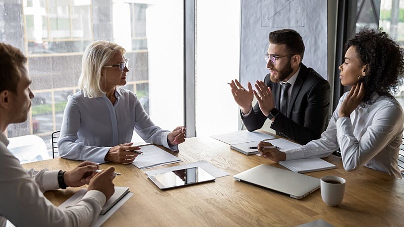 New Pay Transparency RequirementsAre Coming to the EU Serious professional business team in conference room planning strategy