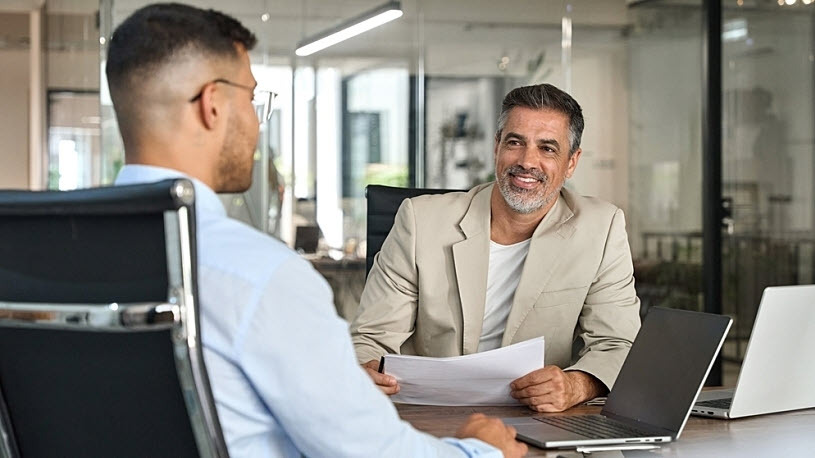 Business consultant meeting with leader about HR outsourcing Business consultant meeting with leader about HR outsourcing