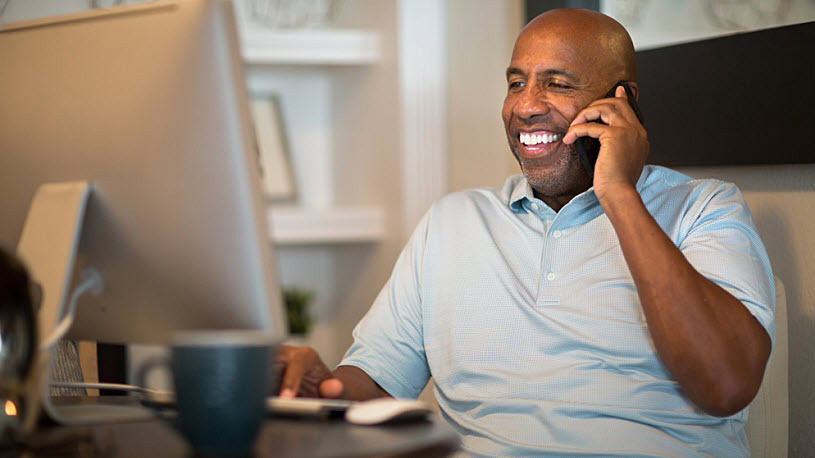 African American man working from his home office African American man working from his home office