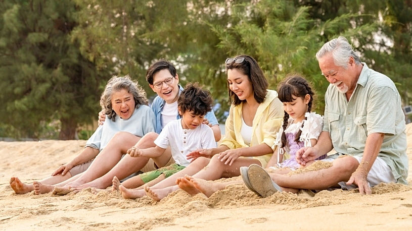 Happy multi-generation Asian famly enjoying a vacation beach day Happy multi-generation Asian famly enjoying a vacation beach day