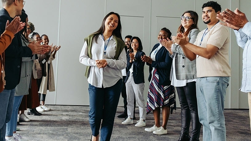 diverse group of employees clapping at casual business conference 5 Proven Strategies to Boost Employee Engagement & Retention