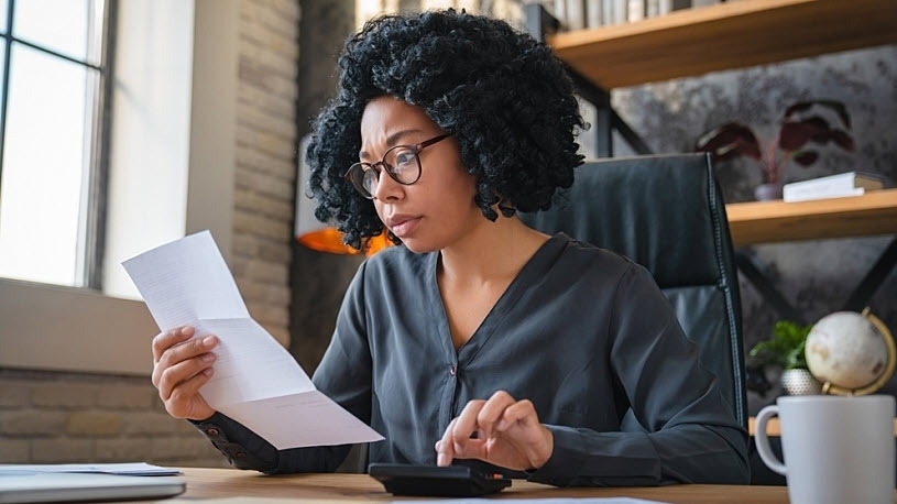 Business Resilience Strategies Young businesswoman calculating business resilience strategy