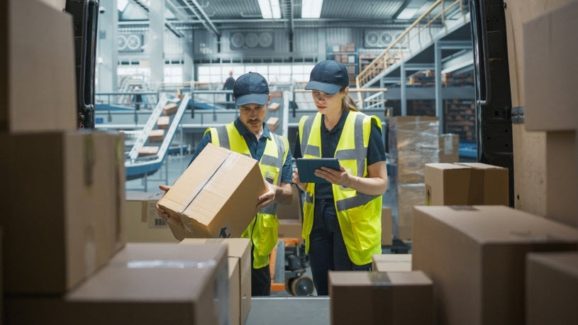 stocking associates using tablet computer to check inventory