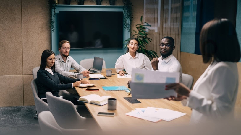 Team of business professionals discusses data integration strategy