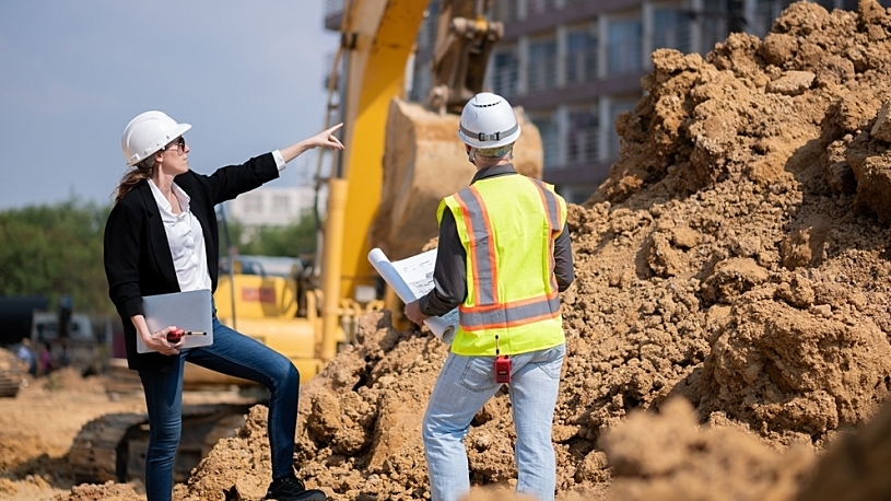 Construction HR leaderwith worker on site