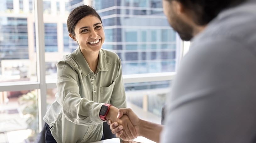 two employees shaking hands