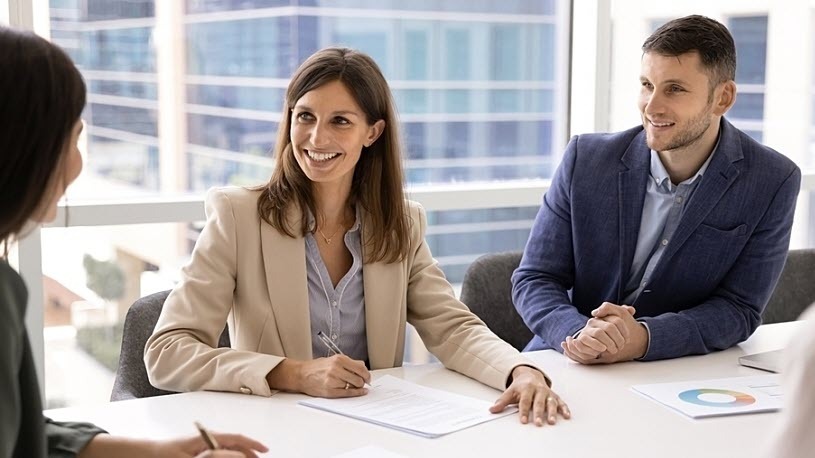 Business leaders signing contract with 401(k) fiduciary partner