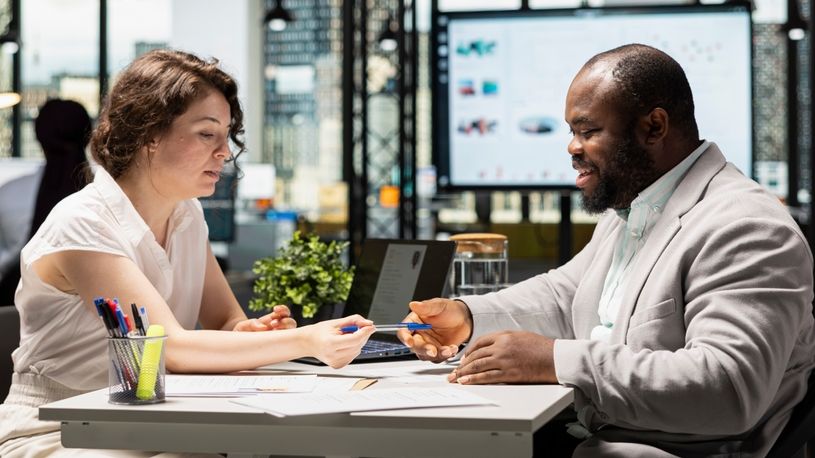 HR leader helps new employee complete HR forms