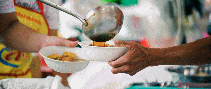 server filling soup bowl server filling soup bowl