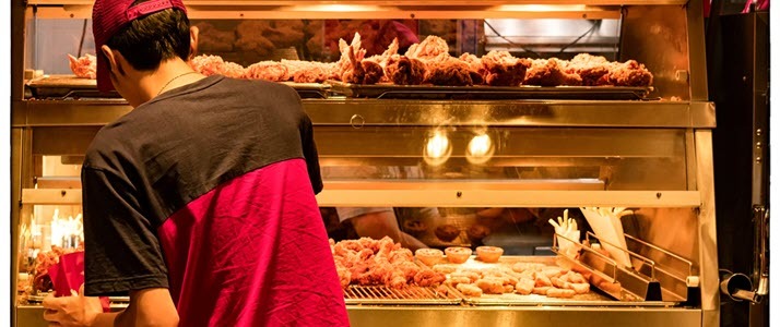 fast food worker with fried chicken fast food worker with friend chicken