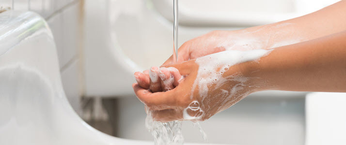 close up of woman washing hands
