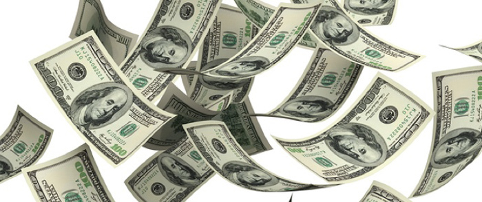 Tax-Saving Strategies Money bills float in the air.