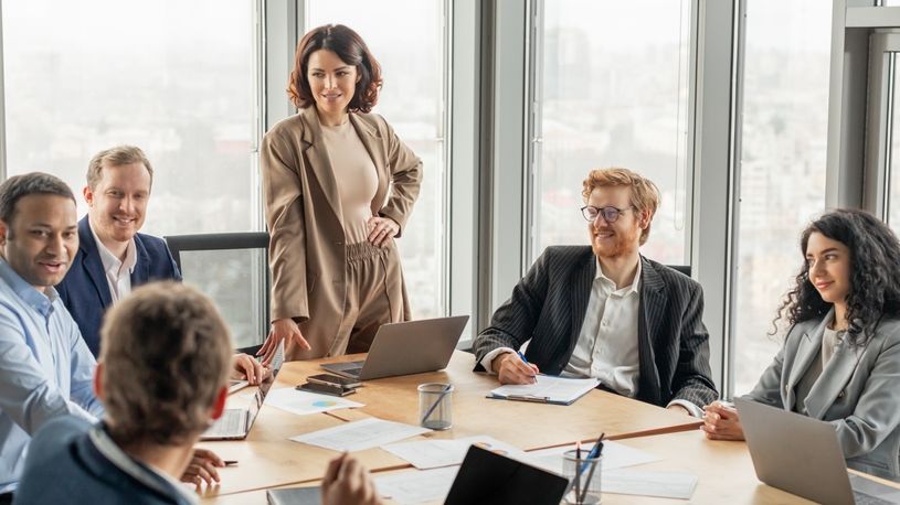 Woman at head of table during a business meeting